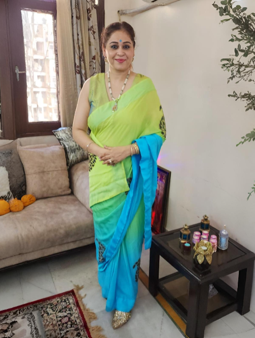 Flowing Georgette Fabric Saree Enhanced by Delicate Appliqué Work